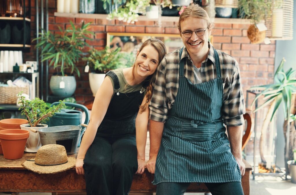 Cropped portrait of two young business owners sitting in their floristry together during the day.