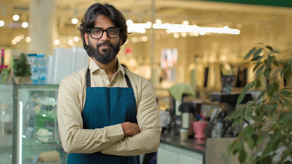 Confident Business Owner Standing in a Shop