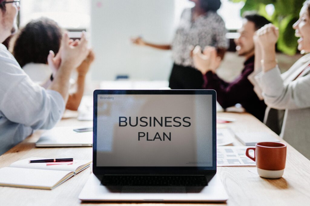 Business Colleagues Celebrating Success in Modern Office