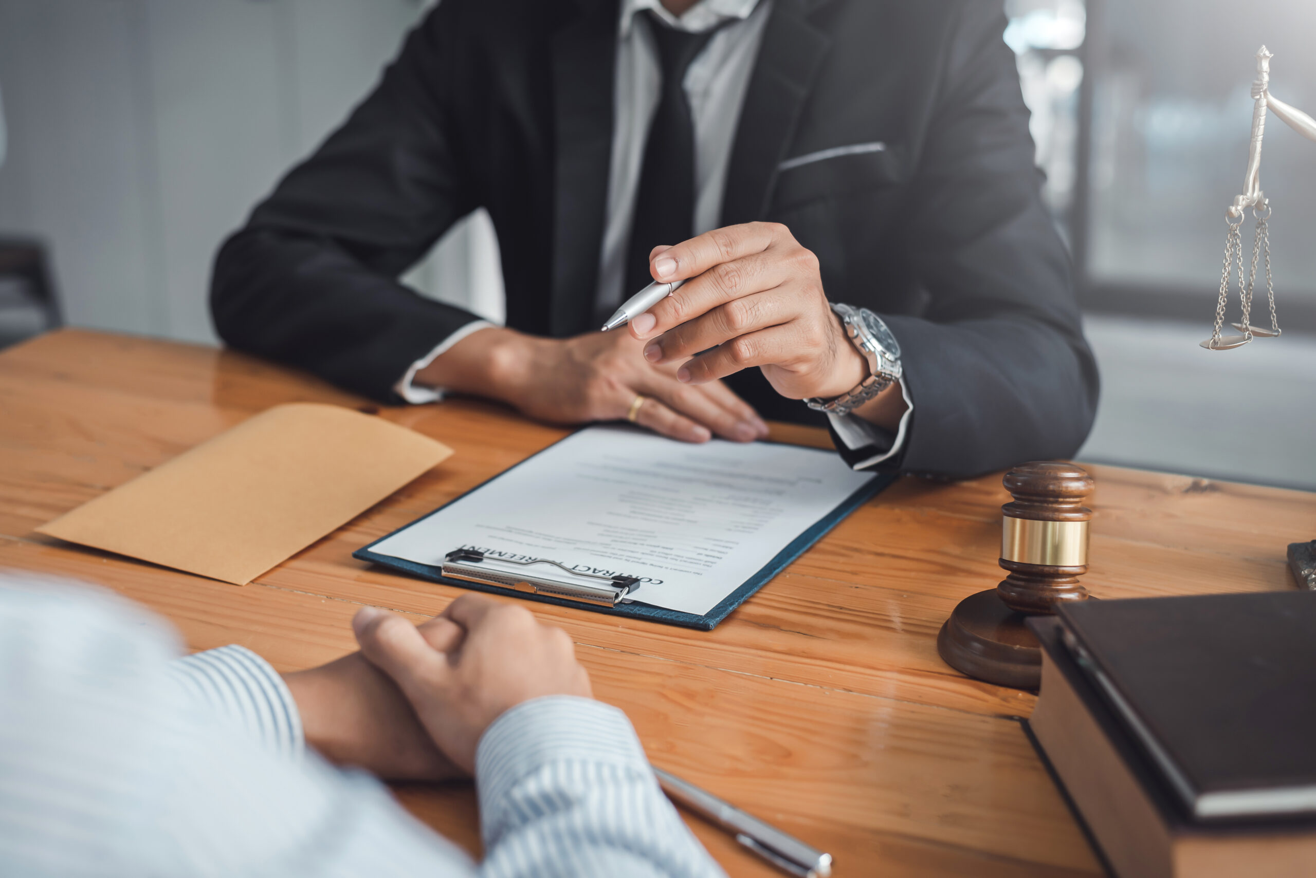Business Meeting with Contract Negotiation at Law Office