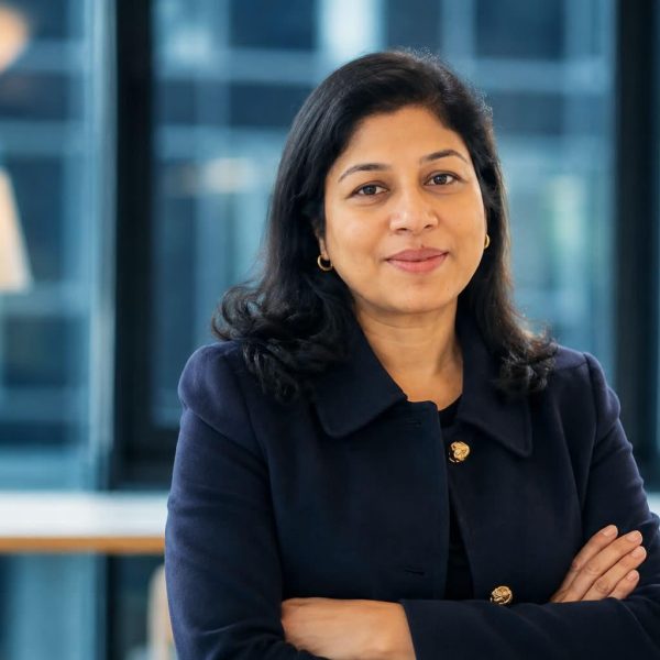 Principal-Sumita-standing-crossed-arms